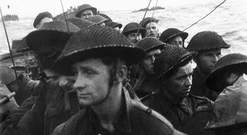 Film still from the D Day landings showing commandos aboard a landing craft on their approach to Sword Beach 6 June 1944. BU1181 credit wikimedia